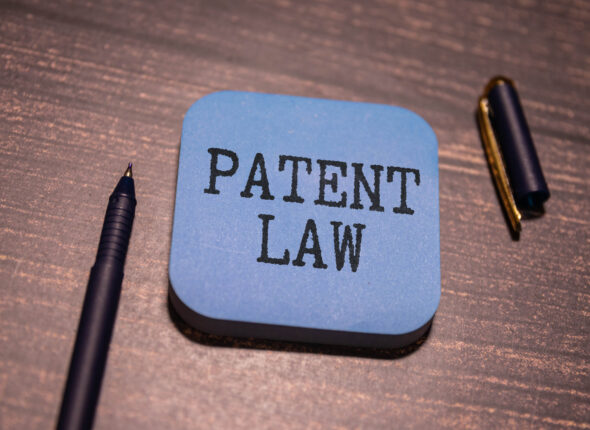 Patent law book. Justice and legislation concept