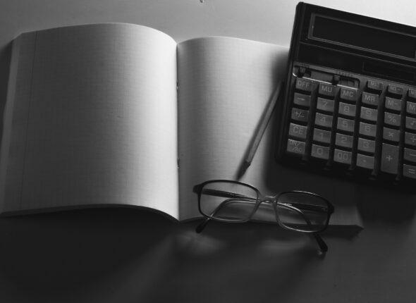 Business concept, Notepad, pencil and calculator on the table