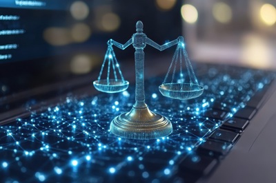 Digital representation of justice scales on a laptop keyboard symbolizing legal technology evolution